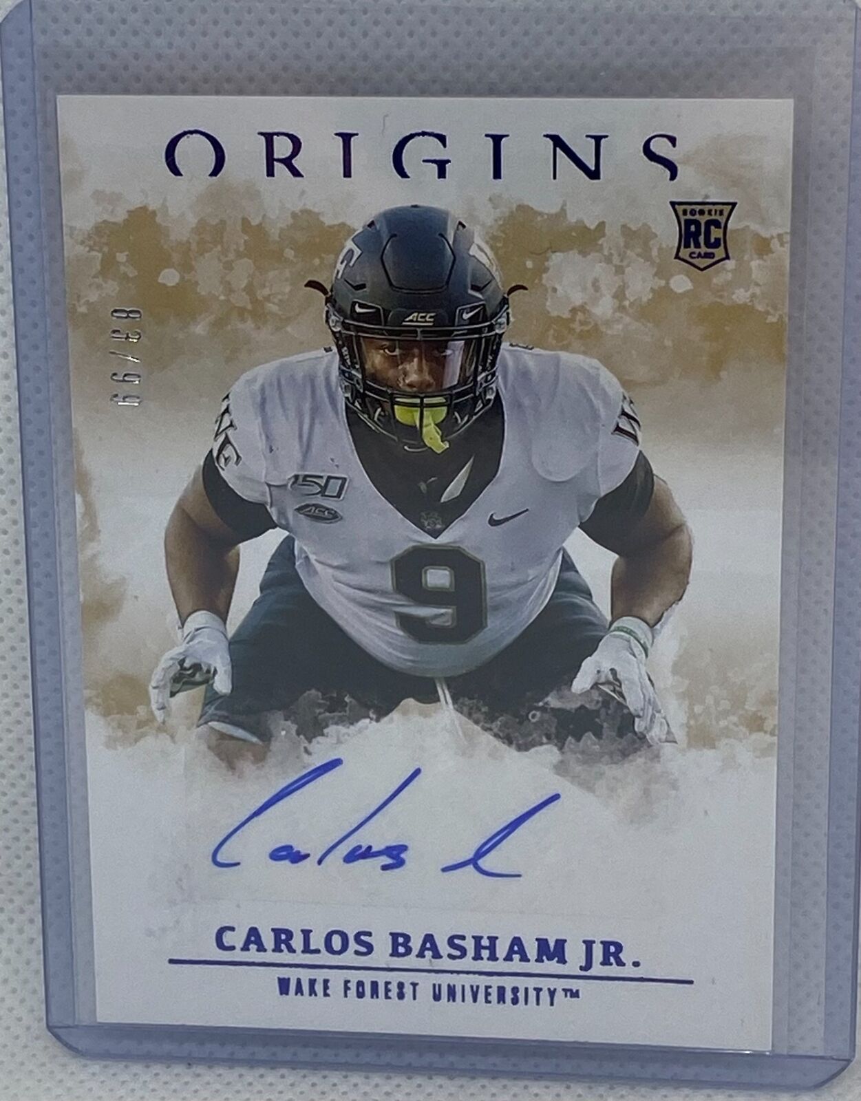 CARLOS BASHAM JR. 2021 PANINI CHRONICLES ORIGINS DRAFT PICKS BLUE AUTO RC #D /99