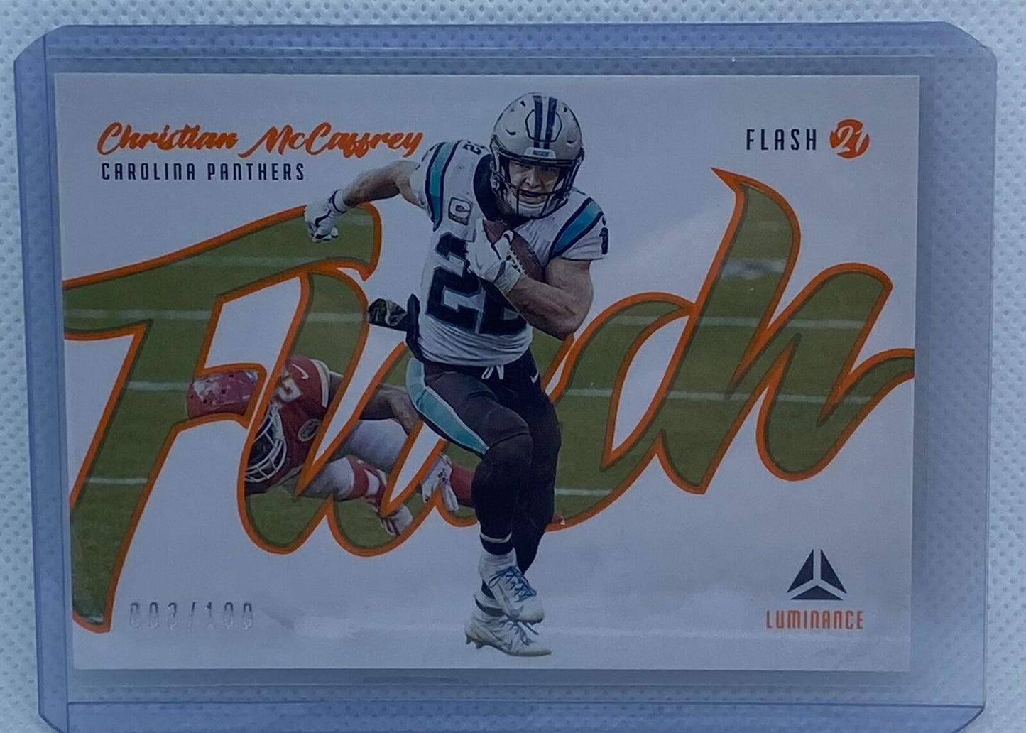 CHRISTIAN MCAFFREY 2021 PANINI LUMINANCE FLASH ORANGE #D 003/100