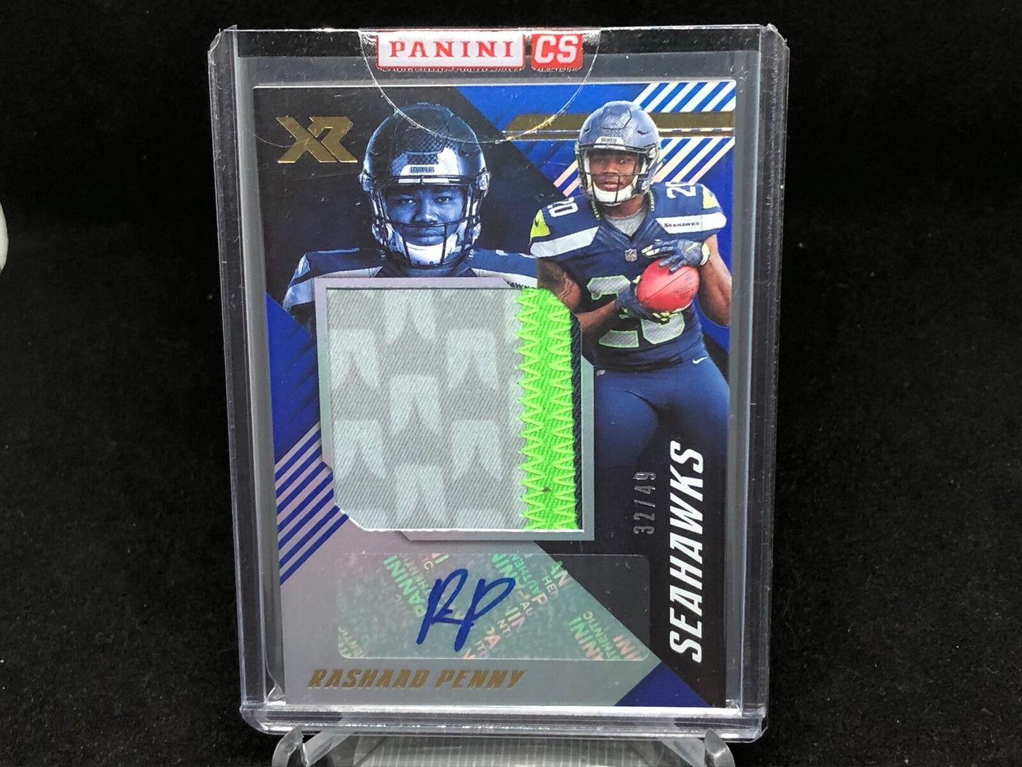 RASHAAD PENNY 2018 PANINI XR BLUE ROOKIE 3 CLR PATCH AUTO RC #D 32/49