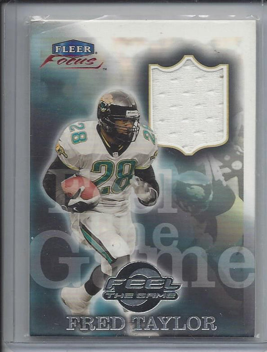 FRED TAYLOR 1999 FLEER FOCUS FEEL THE GAME USED JERSEY #4